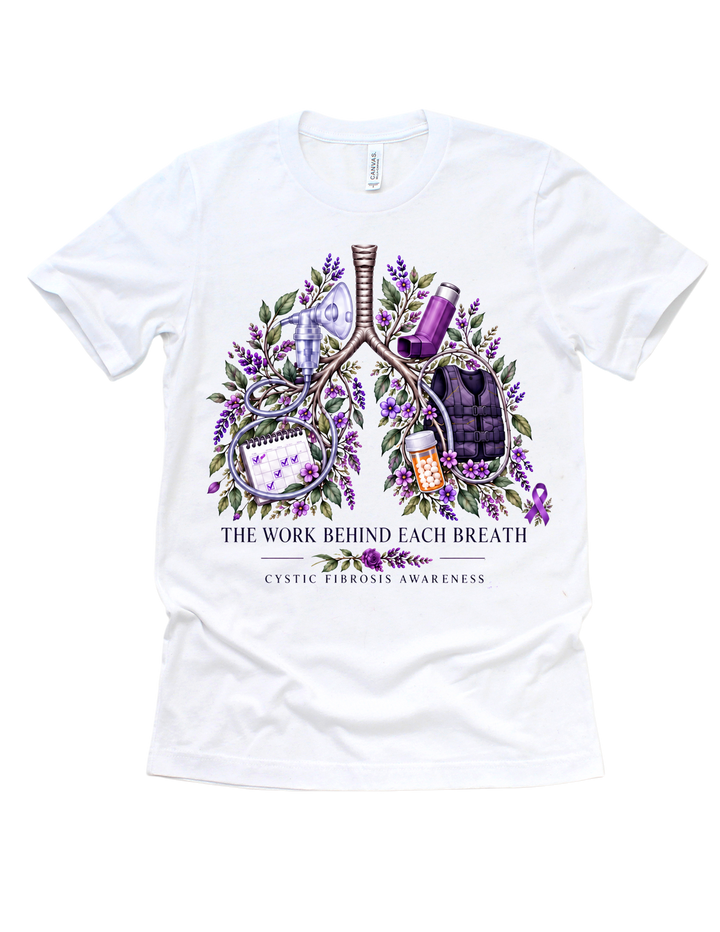 White CF awareness T-shirt with floral lungs, treatment details, and The Work Behind Each Breath wording