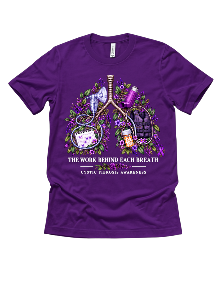 Purple CF awareness T-shirt with floral lungs, treatment details, and The Work Behind Each Breath wording